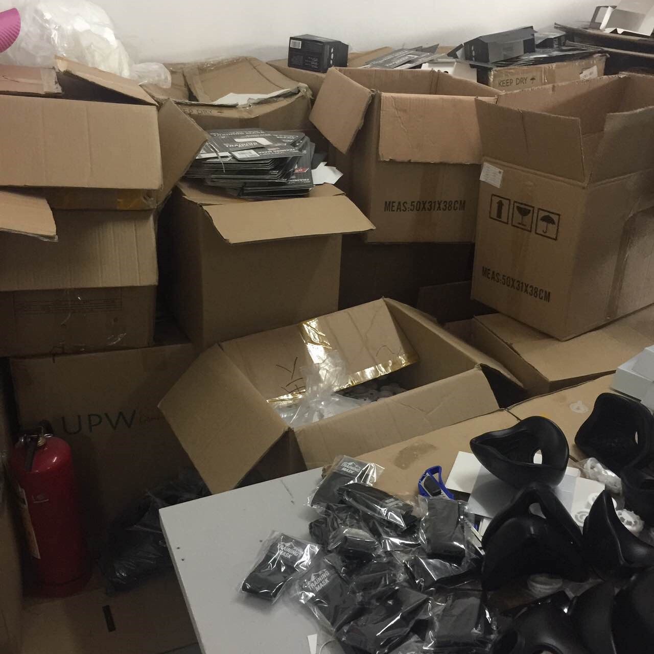 Counterfeit inventory stacked at the illegal manufacturing site